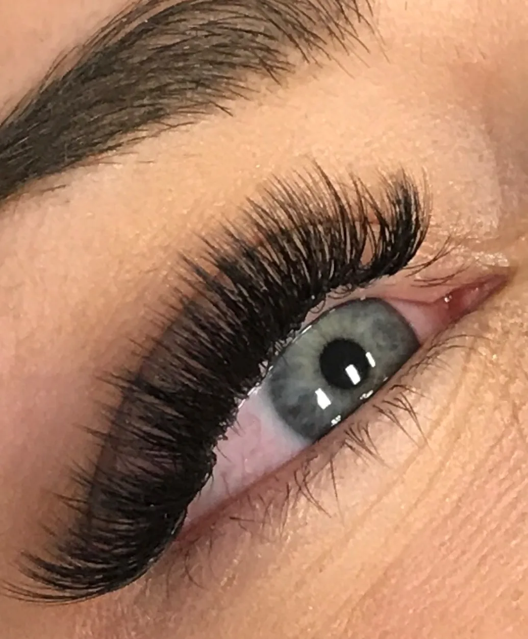 Close-up of single eye with dramatic lash extensions