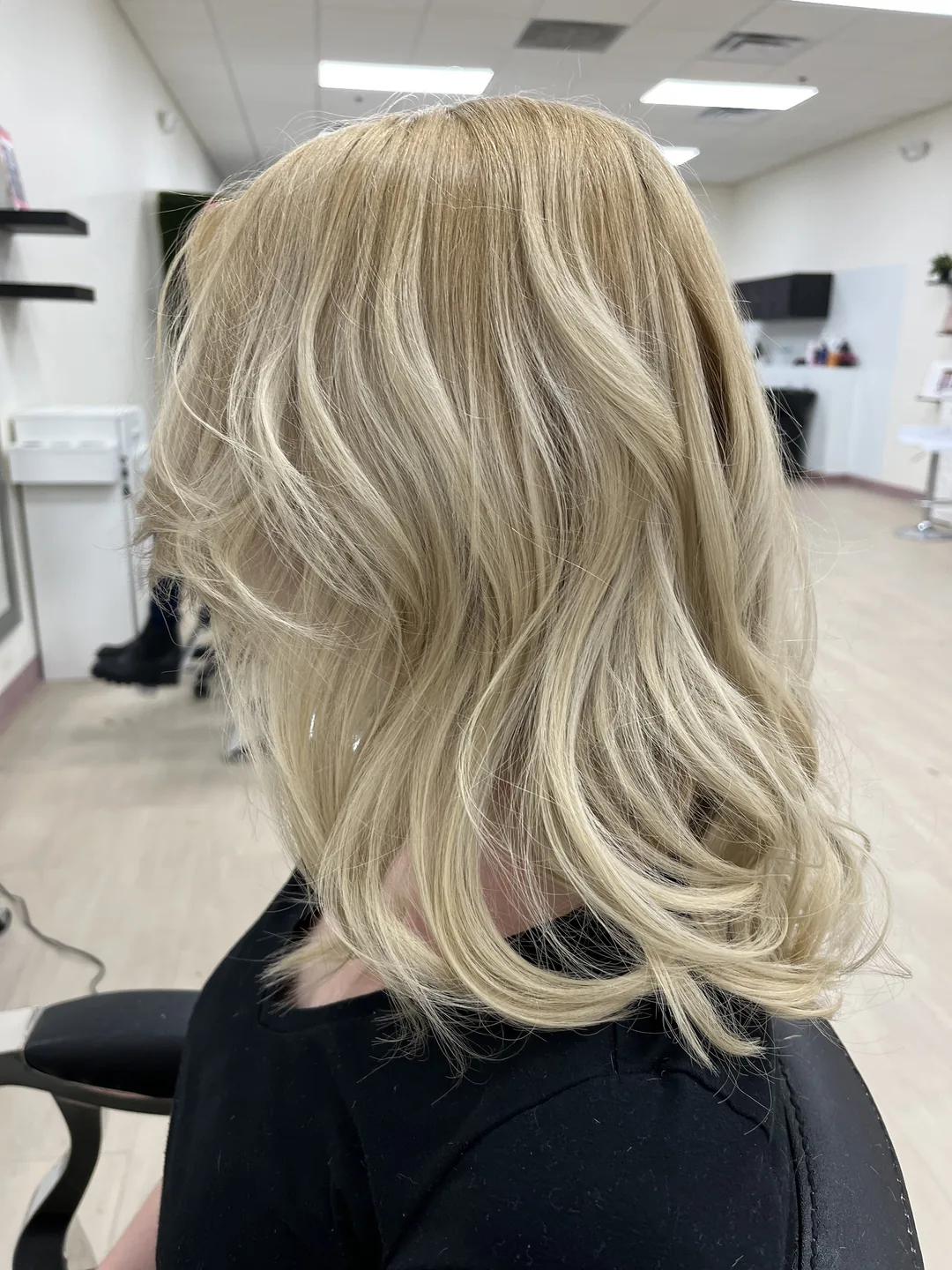 creamy buttery blonde shoulder-length blowout