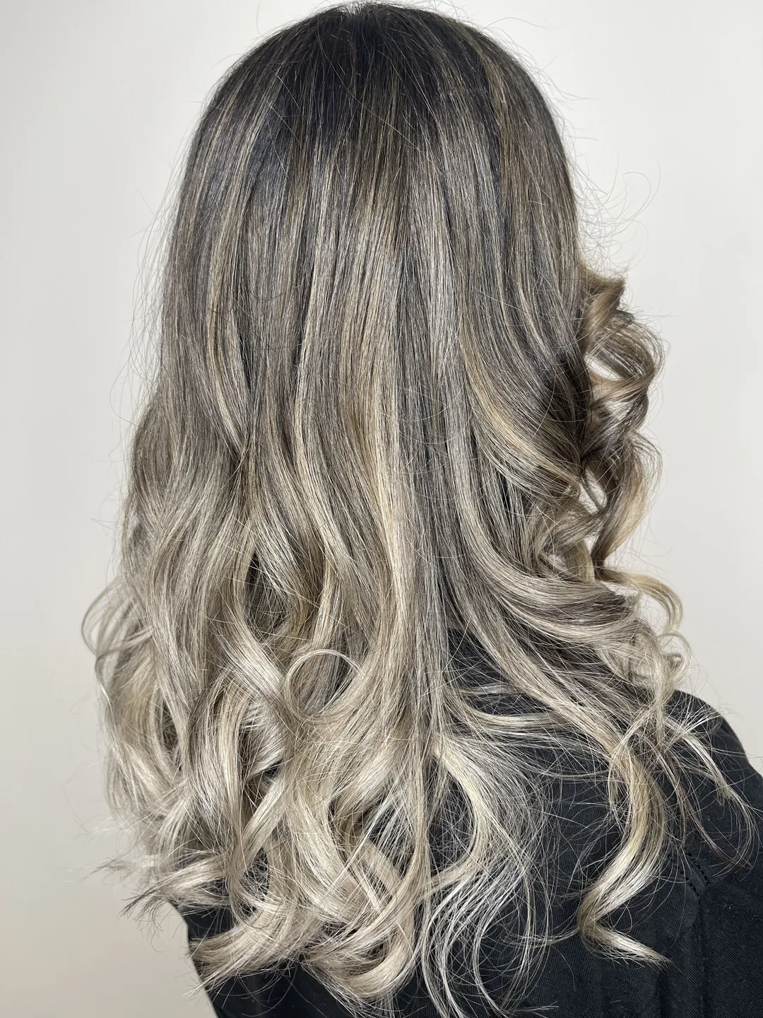 silver-blonde balayage on long curls