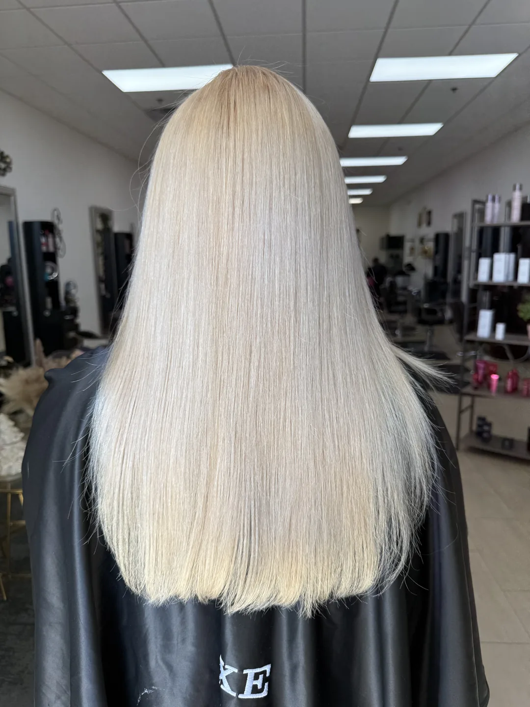 creamy platinum blonde on long straight hair, back view