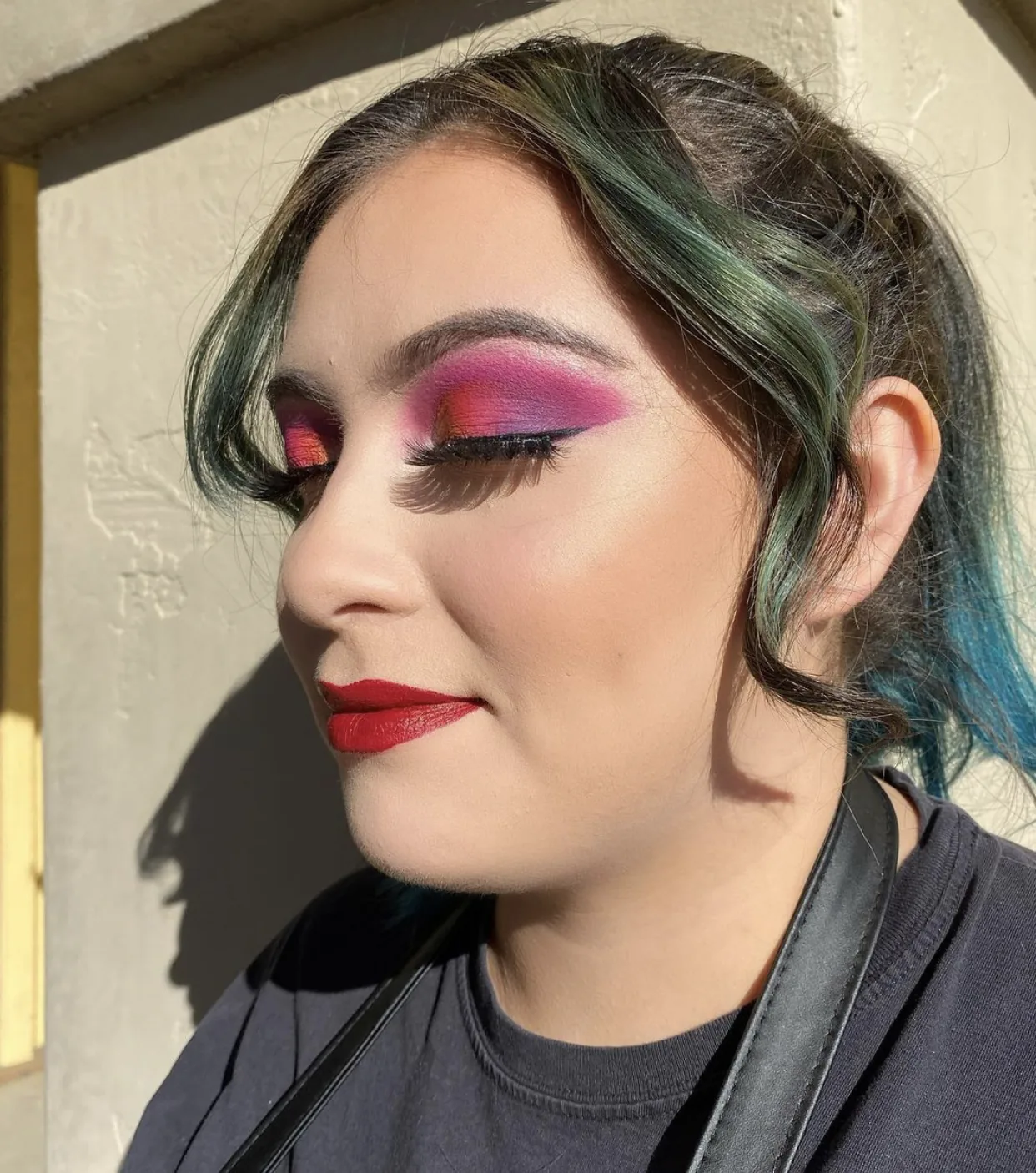 green-teal fashion color with bold makeup outdoor portrait