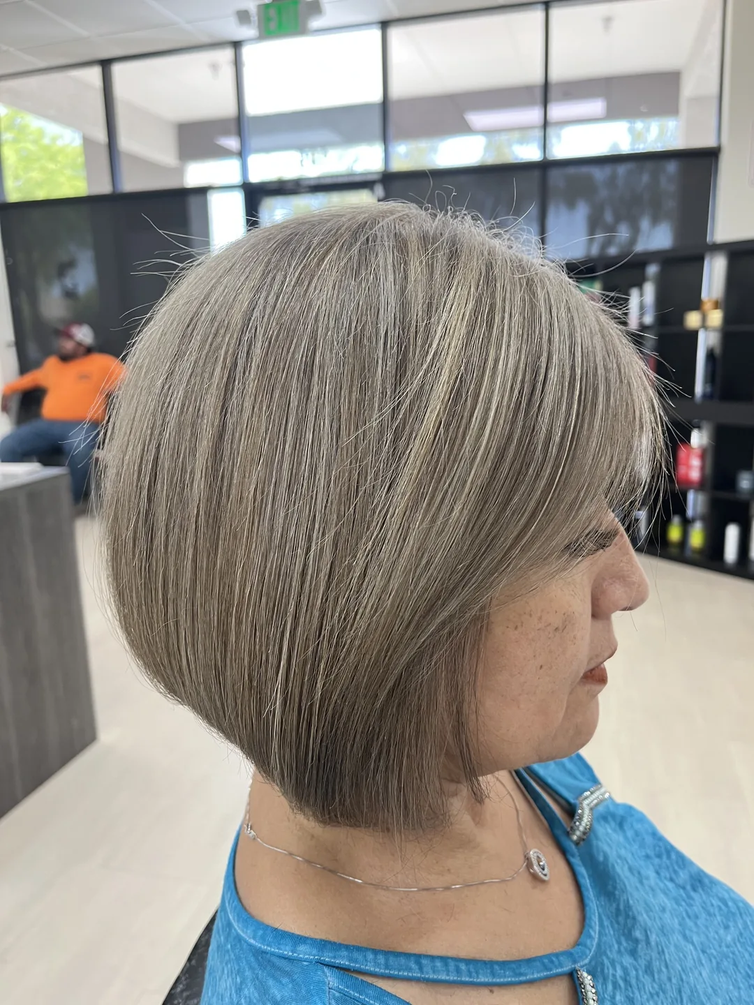 silver-blonde inverted angled bob with bangs