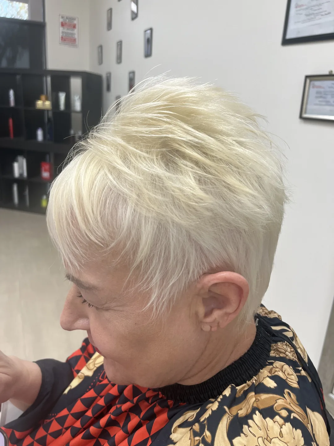 short platinum pixie cut on client mid-service