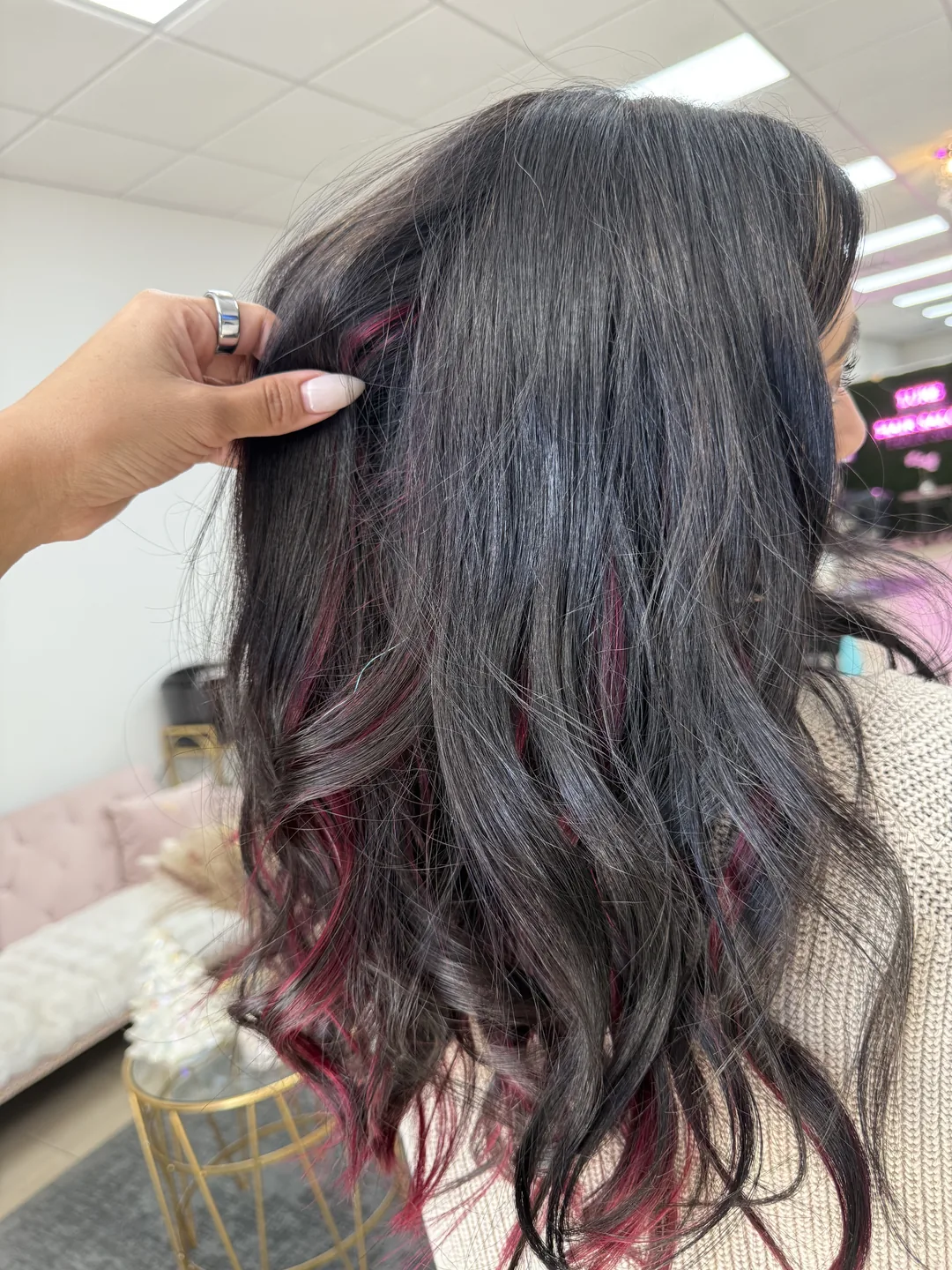 Long dark waves with a hidden magenta peekaboo underlayer, back view