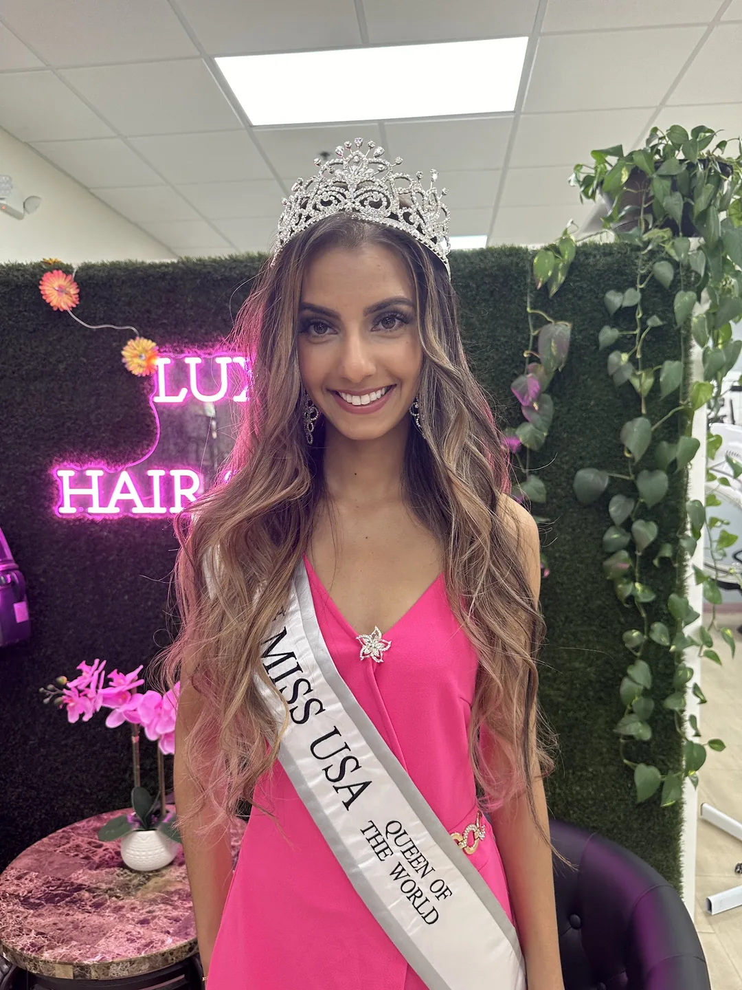 Miss USA contestant with crown and sash at salon